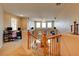 Spacious loft area with a view of the living room below and multiple workstations with computers at 98 Milicity Rd, Henderson, NV 89012