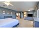 Expansive main bedroom retreat featuring a bed, seating area, and doorway to a full ensuite bathroom at 98 Milicity Rd, Henderson, NV 89012