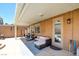 The covered patio features a lounge set and workout equipment for enjoying the fresh air at 98 Milicity Rd, Henderson, NV 89012