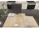 New kitchen samples display luxury vinyl plank flooring, quartz countertops, upgraded cabinets, and upgraded carpet at 9912 Landings St, Las Vegas, NV 89141