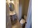 Cozy powder room featuring a pedestal sink and standard toilet at 10449 Forked Run St, Las Vegas, NV 89178
