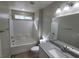 Bright bathroom featuring a tub, shower, modern vanity, and updated fixtures at 10449 Forked Run St, Las Vegas, NV 89178