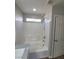 Bright bathroom featuring a tub, shower, and updated fixtures at 10449 Forked Run St, Las Vegas, NV 89178