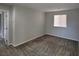 A neutral-colored bedroom features a window and carpeted floors at 10449 Forked Run St, Las Vegas, NV 89178