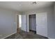 This bedroom has a closet and a door leading to the staircase and is newly renovated at 10449 Forked Run St, Las Vegas, NV 89178