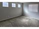 A neutral-colored bedroom features a window and carpeted floors at 10449 Forked Run St, Las Vegas, NV 89178