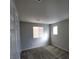 This bedroom has neutral paint and carpet with great natural light from the window at 10449 Forked Run St, Las Vegas, NV 89178