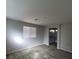 A bedroom features a view into the ensuite bathroom at 10449 Forked Run St, Las Vegas, NV 89178