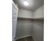 This is a walk-in closet with a shelf and wood-look floors at 10449 Forked Run St, Las Vegas, NV 89178