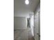 Upstairs hallway featuring neutral carpet and paint, with several doorways leading to rooms at 10449 Forked Run St, Las Vegas, NV 89178