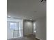 Upstairs hallway features double doors, a window, and carpeted floors at 10449 Forked Run St, Las Vegas, NV 89178