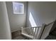 Bright carpeted staircase with white railing at 10449 Forked Run St, Las Vegas, NV 89178