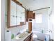 Bathroom features a tub, mirror, sink, and cabinets at 1213 New Mexico St, Boulder City, NV 89005