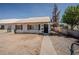 Inviting single-story home with sidewalk leading to the front door and simple desert landscaping at 1213 New Mexico St, Boulder City, NV 89005
