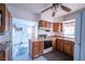 Kitchen with wooden cabinets, countertop, stove, and sink at 1213 New Mexico St, Boulder City, NV 89005