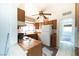 Kitchen with wooden cabinets, countertop, stove, sink, and white refrigerator at 1213 New Mexico St, Boulder City, NV 89005