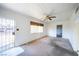 Cozy living room with ample natural light from a large window and view of the entry door at 1213 New Mexico St, Boulder City, NV 89005