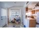 Sun room with open view to kitchen and laundry equipment at 1213 New Mexico St, Boulder City, NV 89005