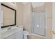Bathroom featuring a single sink vanity, toilet, and a glass-enclosed shower at 1557 Sabatini Dr, Henderson, NV 89052