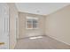 Bedroom with neutral carpet, walls, and a window providing natural light at 1557 Sabatini Dr, Henderson, NV 89052