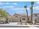 Charming two-story home featuring desert landscaping, a two car garage, and a welcoming entrance at 1557 Sabatini Dr, Henderson, NV 89052