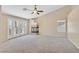 Spacious living room with vaulted ceiling, fireplace and access to outdoor deck at 1557 Sabatini Dr, Henderson, NV 89052