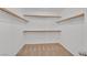 Walk-in closet with carpeted floor and built-in shelving at 1557 Sabatini Dr, Henderson, NV 89052