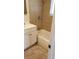 A white bathroom with a single sink, a window, and a shower over the tub at 1936 Lawry Ave, North Las Vegas, NV 89032