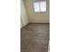 A bright room with hardwood floors and a window at 1936 Lawry Ave, North Las Vegas, NV 89032