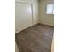 A bright room with hardwood floors, a sliding closet, and a window at 1936 Lawry Ave, North Las Vegas, NV 89032