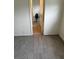 Hallway with hardwood floors, leading to a bright room at 1936 Lawry Ave, North Las Vegas, NV 89032