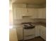Functional kitchen with white cabinets and a vintage electric range at 1936 Lawry Ave, North Las Vegas, NV 89032