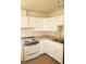 Functional kitchen with white cabinets and a vintage electric range at 1936 Lawry Ave, North Las Vegas, NV 89032