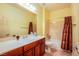 Bright bathroom featuring a tub/shower combo and a single sink vanity at 2131 Sandstone Cliffs Dr, Henderson, NV 89044