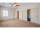 Bedroom featuring three closets and a shuttered window for natural light at 2131 Sandstone Cliffs Dr, Henderson, NV 89044