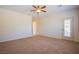 Bedroom with neutral carpet and bright door to the backyard at 2131 Sandstone Cliffs Dr, Henderson, NV 89044