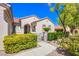 Charming single-story home featuring a gated entrance and mature landscaping at 2131 Sandstone Cliffs Dr, Henderson, NV 89044
