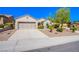 Single-story house featuring a two-car garage and well-maintained yard at 2131 Sandstone Cliffs Dr, Henderson, NV 89044