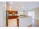 Bright kitchen featuring granite countertops, stainless steel appliances, and ample cabinet space at 2131 Sandstone Cliffs Dr, Henderson, NV 89044