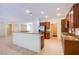 Kitchen area showcasing wood cabinets, granite countertops, and stainless steel appliances at 2131 Sandstone Cliffs Dr, Henderson, NV 89044