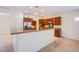 Kitchen featuring cherry wood cabinets, granite countertops, and stainless steel appliances at 2131 Sandstone Cliffs Dr, Henderson, NV 89044