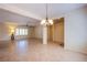 Open-concept living space with tile flooring and natural lighting at 2131 Sandstone Cliffs Dr, Henderson, NV 89044