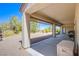 Covered patio with ample space for outdoor dining and relaxation at 2131 Sandstone Cliffs Dr, Henderson, NV 89044