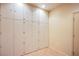Ample storage room with large white cabinets and tiled flooring for organized living at 2131 Sandstone Cliffs Dr, Henderson, NV 89044