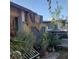 Exterior view of a backyard featuring plants, trees, and privacy fencing at 2315 Perliter Ave, North Las Vegas, NV 89030
