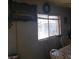 Dining room with window, table, and chairs, and a simple wall decoration at 2315 Perliter Ave, North Las Vegas, NV 89030