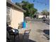 Wide driveway and backyard with a parked car and neutral colored walls at 2315 Perliter Ave, North Las Vegas, NV 89030
