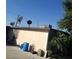 Exterior view of a one-story home and backyard, featuring landscaping at 2315 Perliter Ave, North Las Vegas, NV 89030