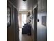 Hallway leading to a living room with tile flooring and neutral color scheme at 2315 Perliter Ave, North Las Vegas, NV 89030