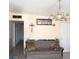 Cozy living room with sofa, decorative chandelier and neutral color palette at 2315 Perliter Ave, North Las Vegas, NV 89030